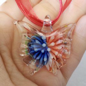 2/25$ nwot Butterfly glass pendant on a Organza Ribbon